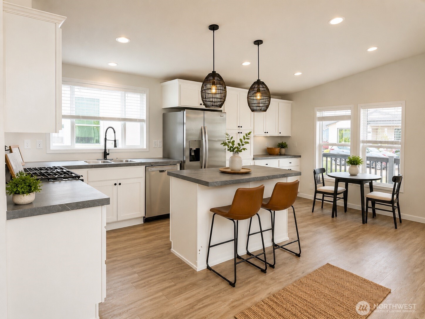 Model kitchen and dining area of a manufactured home at Crystal Mountain