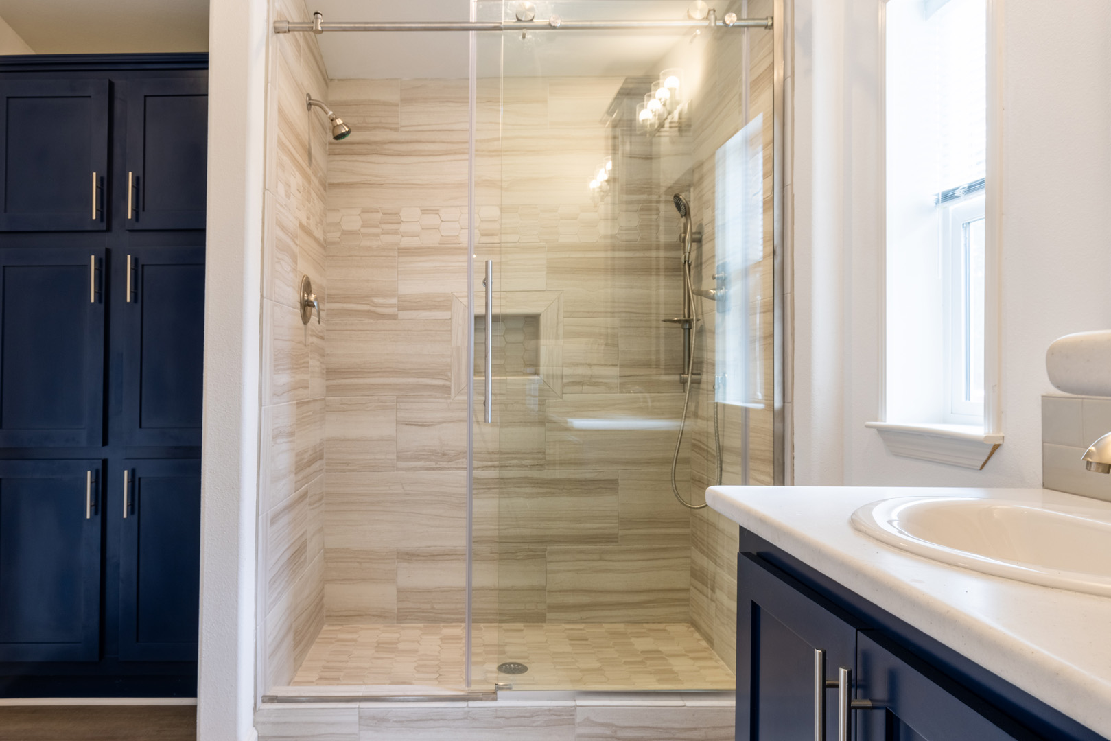 bathroom walk in shower and cabinetry