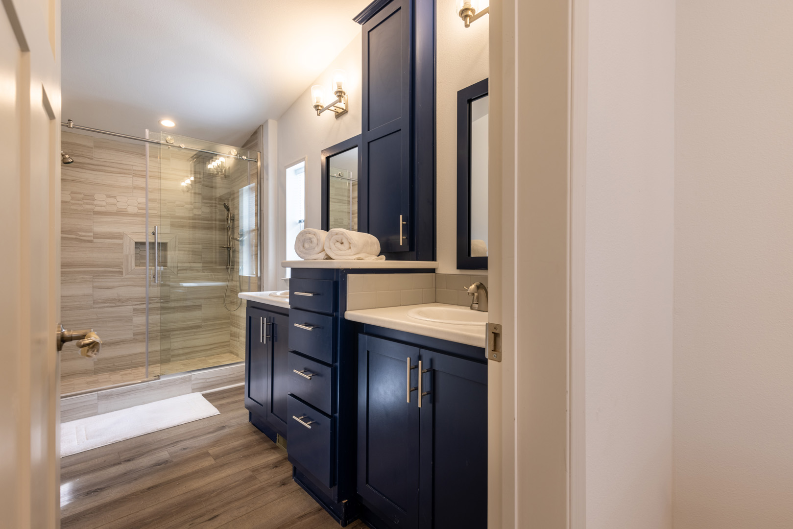 double sink vanity and glass shower