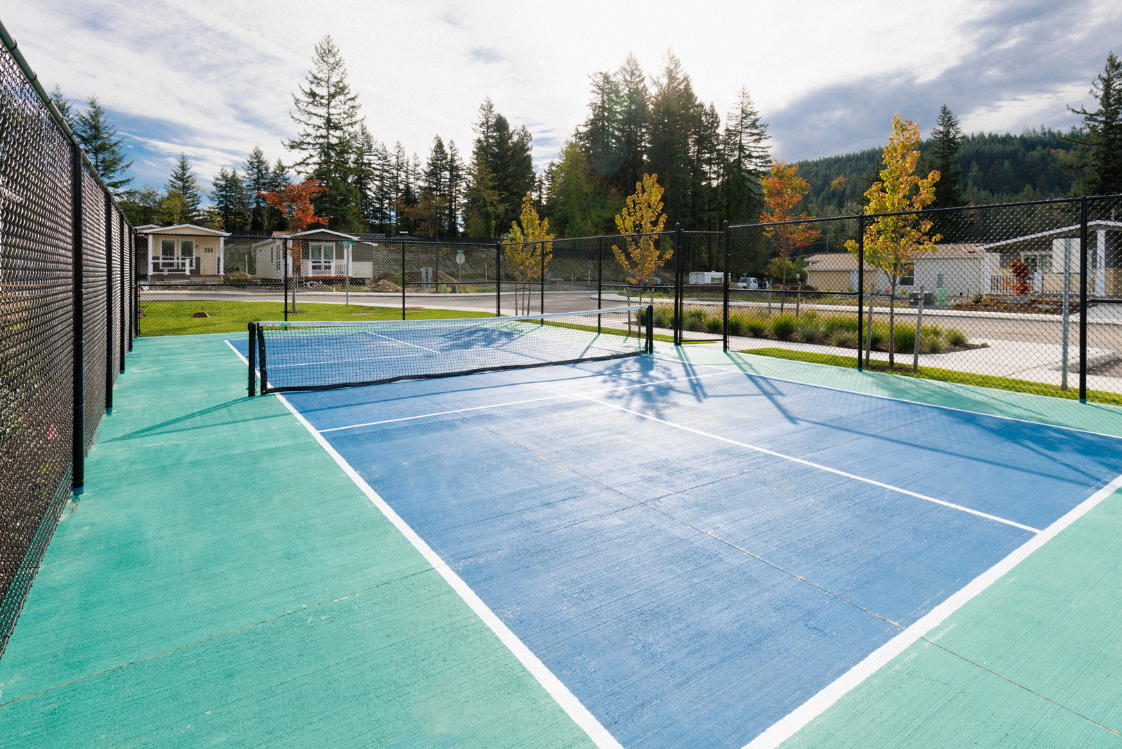 fenced outdoor pickleball playing court