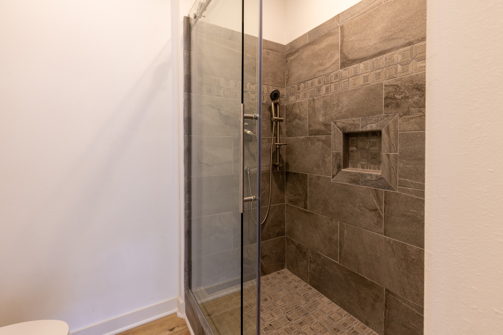 glass door tiled bathroom shower stall