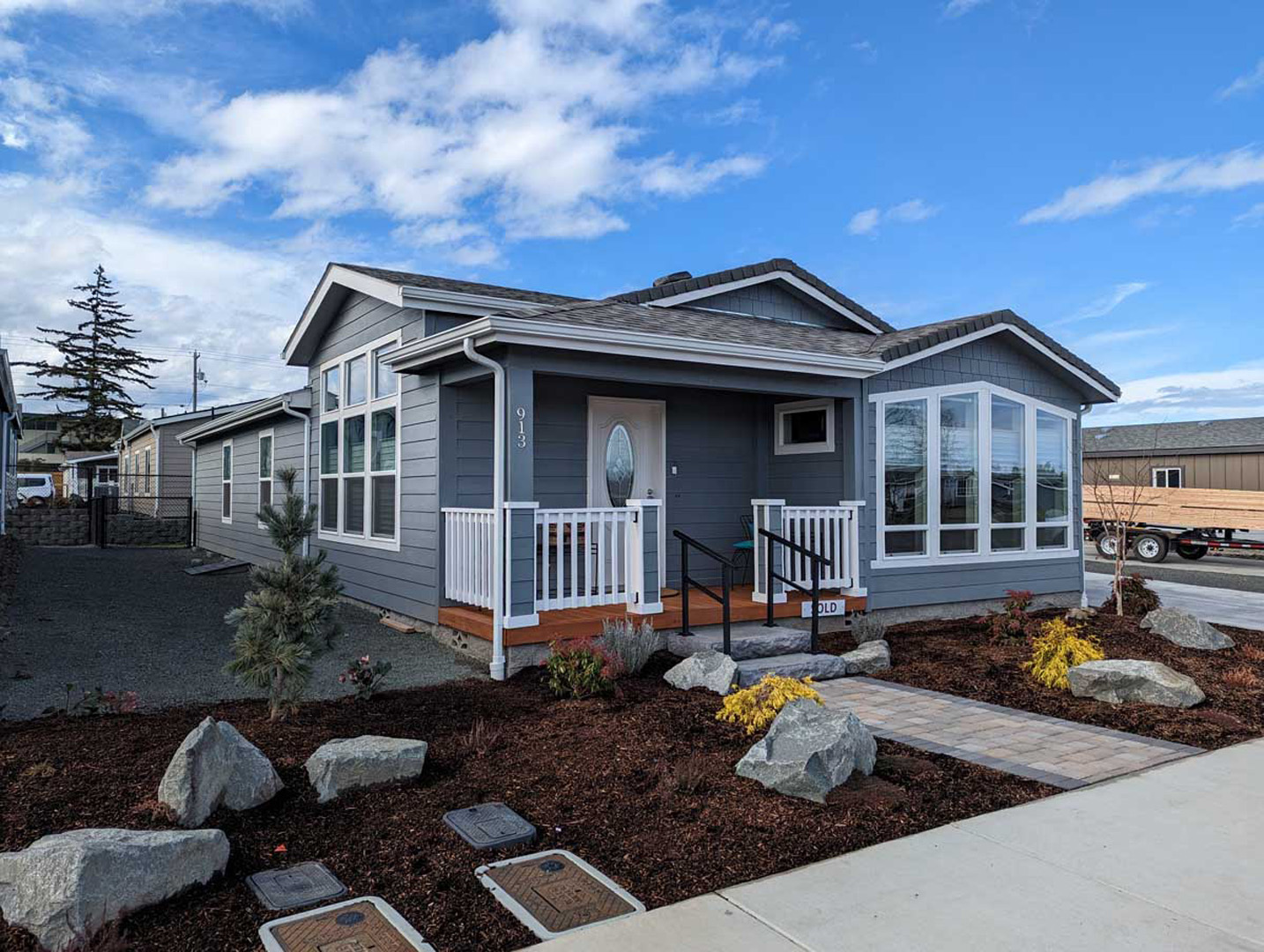 Manufactured home with landscaped yard at Crystal Mountain