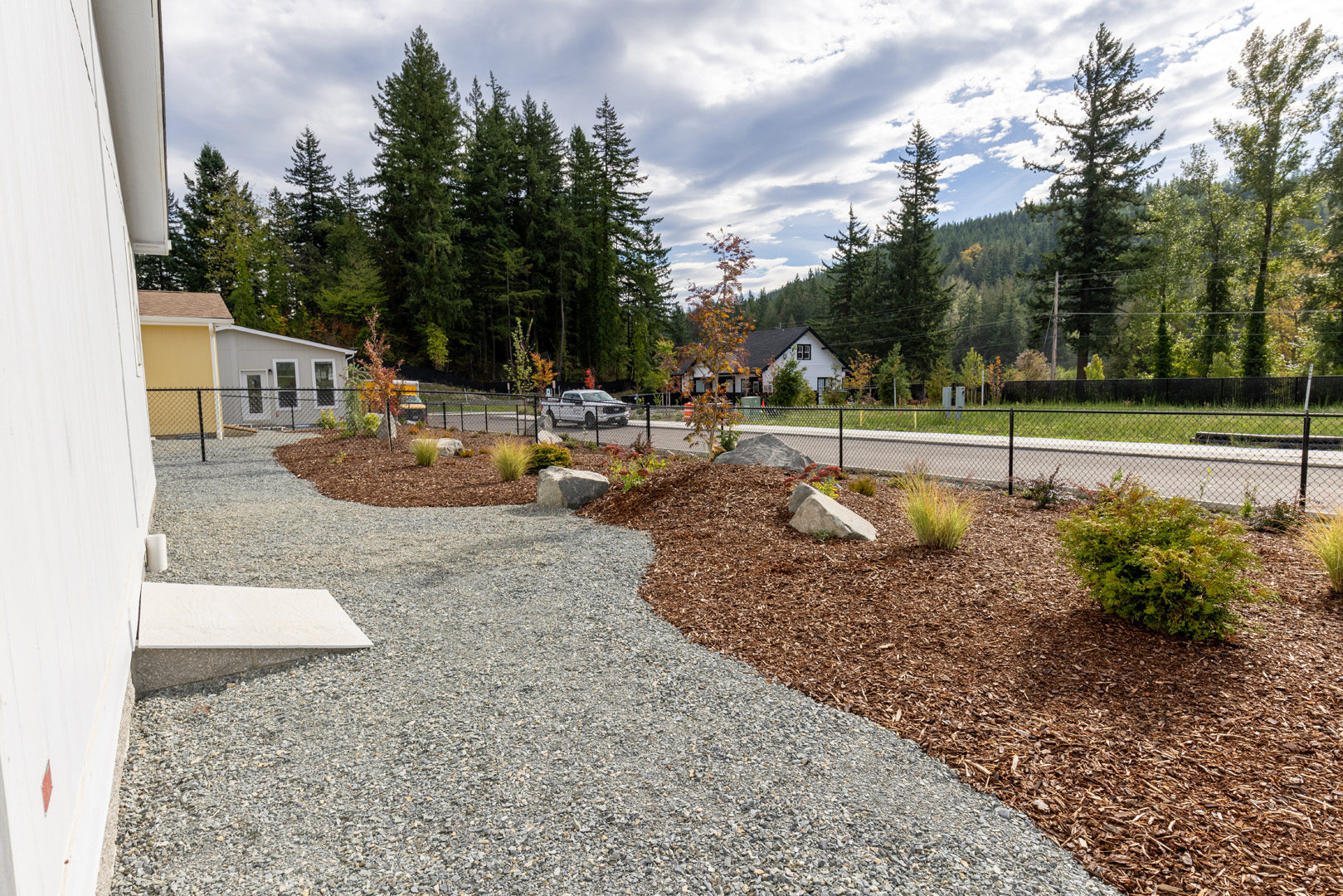 residential fenced yard and mulched landscape