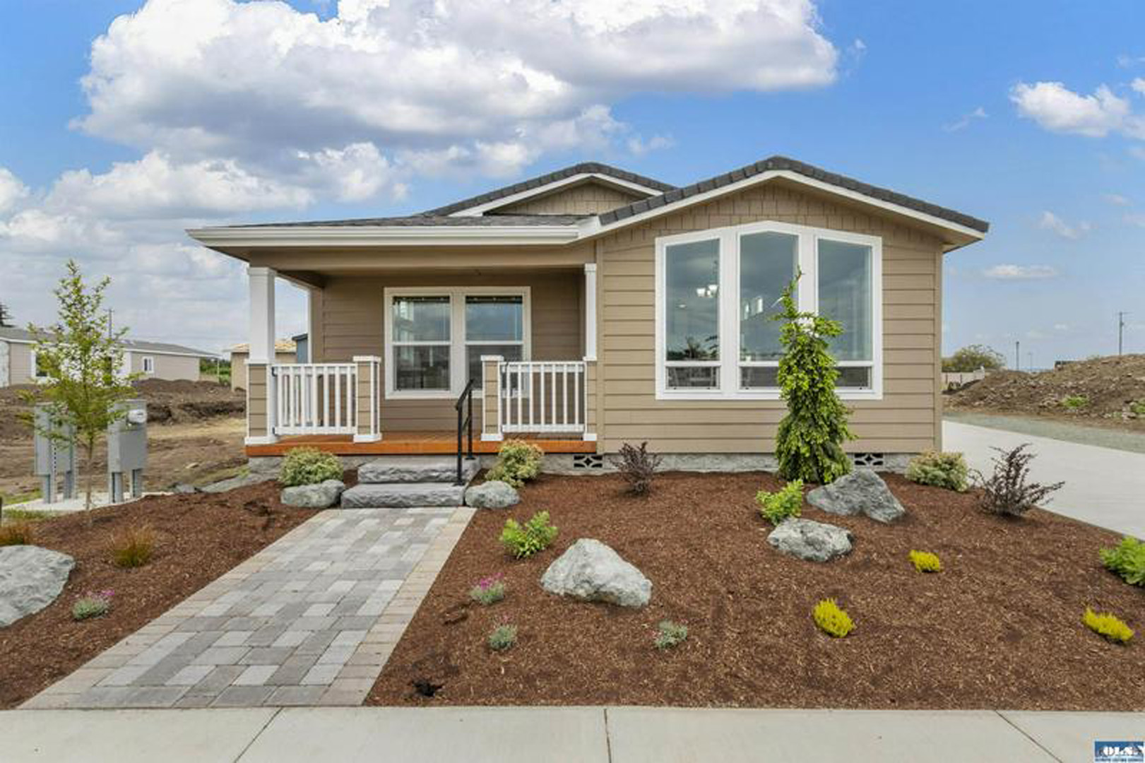 tan manufactured home facade with walkway