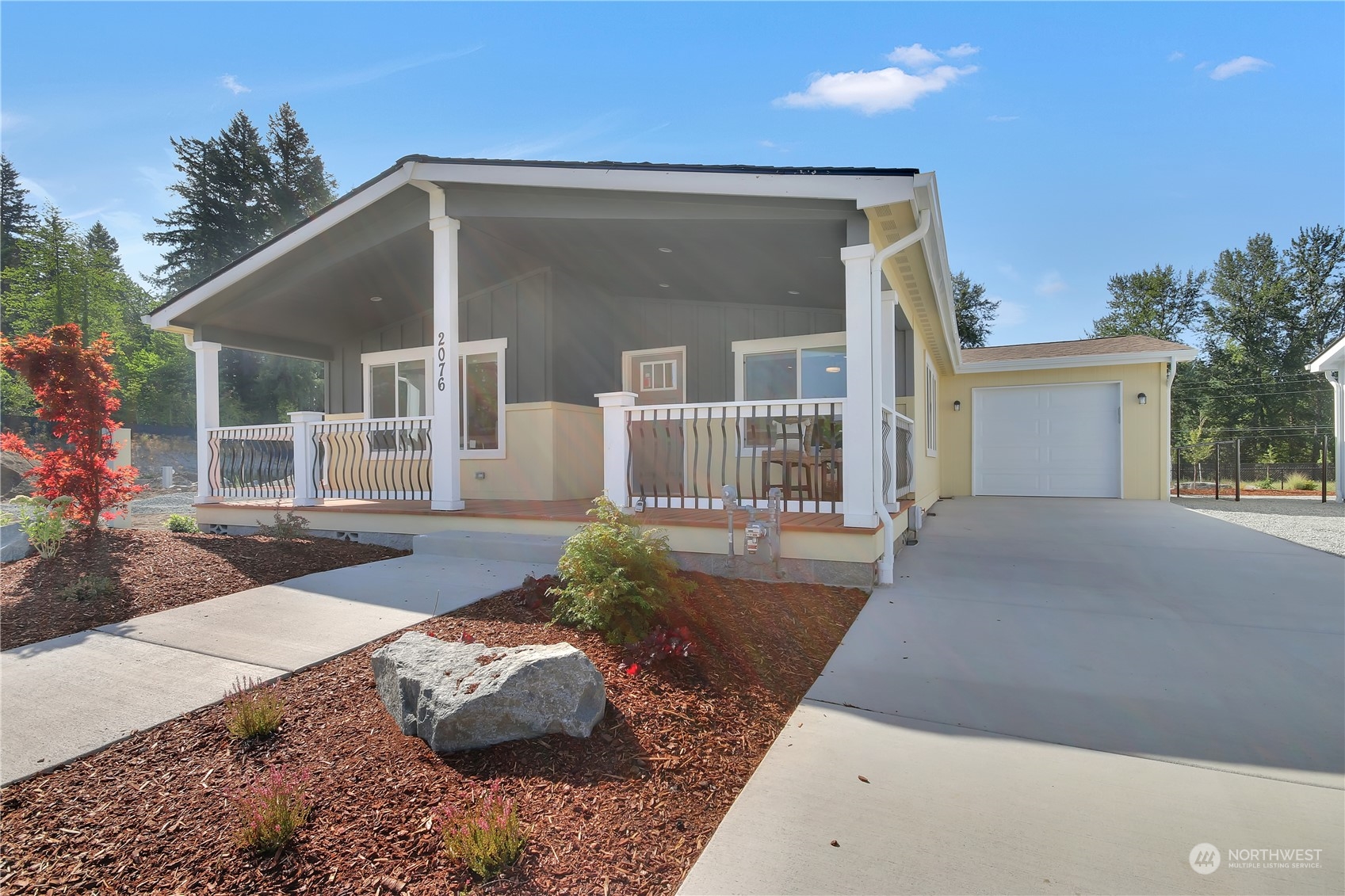 yellow residence with covered front porch