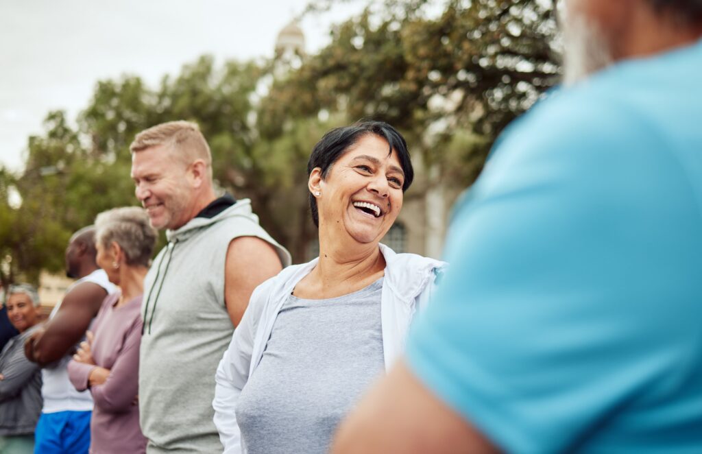 group smiling in a retirement community clubhouse