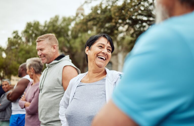 group smiling in a retirement community clubhouse