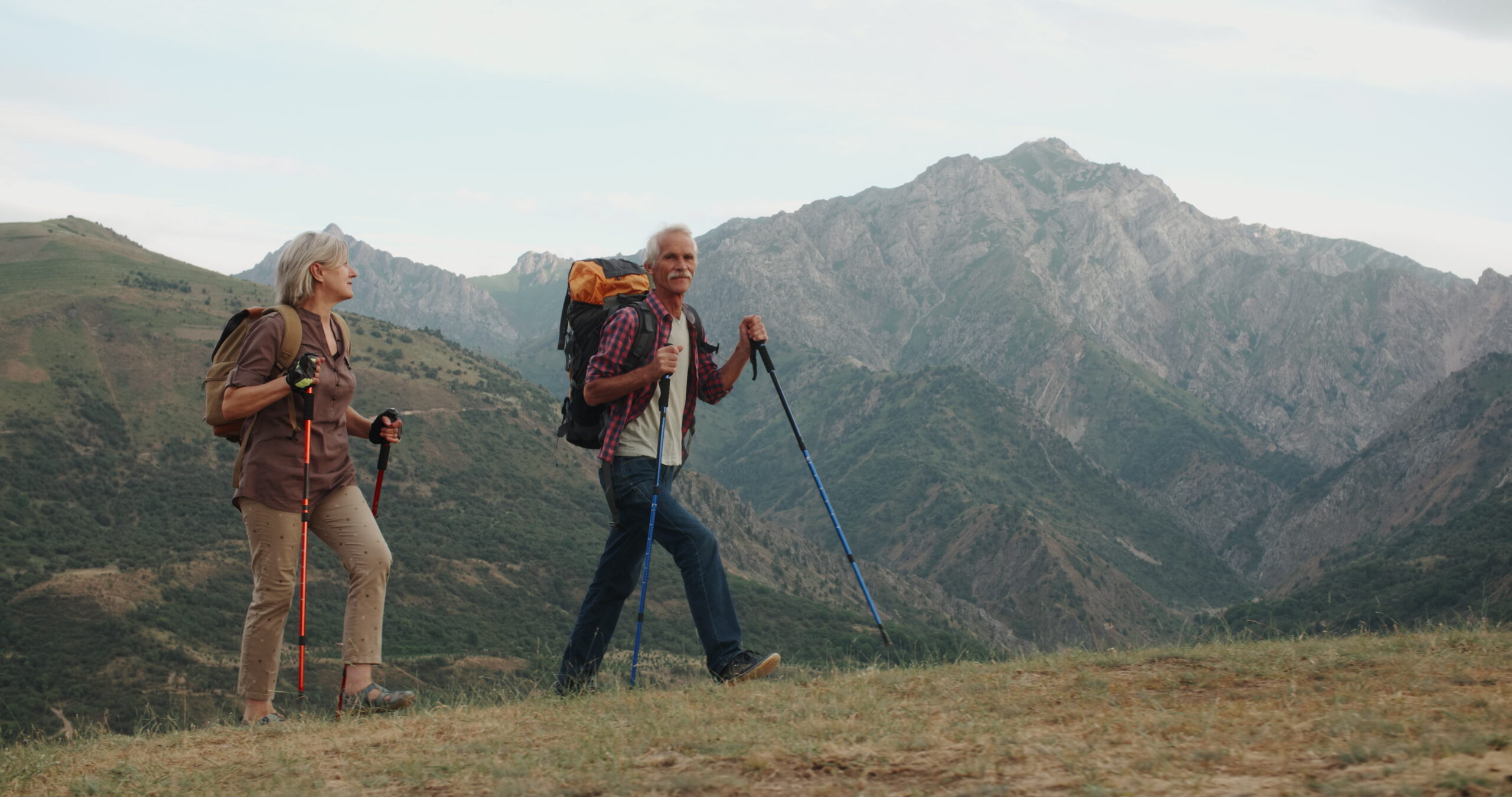 senior hikers on mountain trail scaled