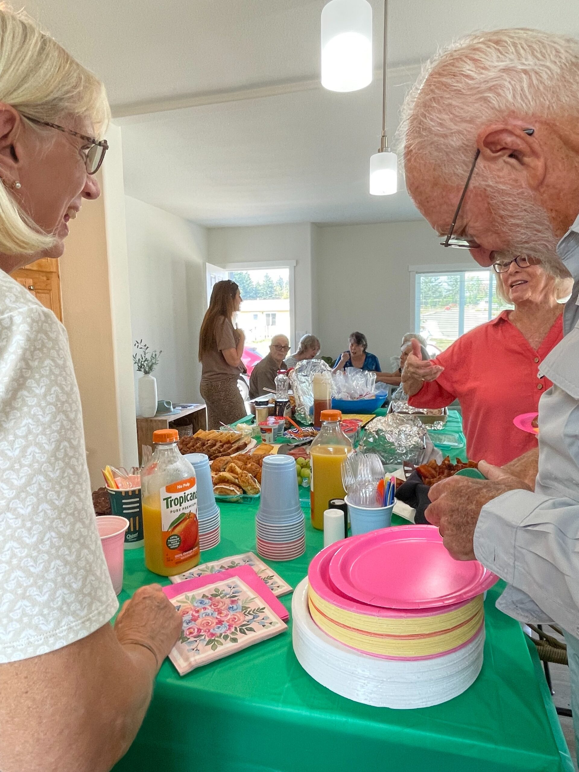 Residents chatting over breakfast in the clubhouse at Crystal Mountain MHC